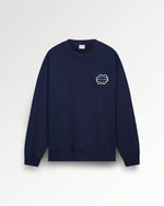 Navy blue sweatshirt with a logo on a light gray background